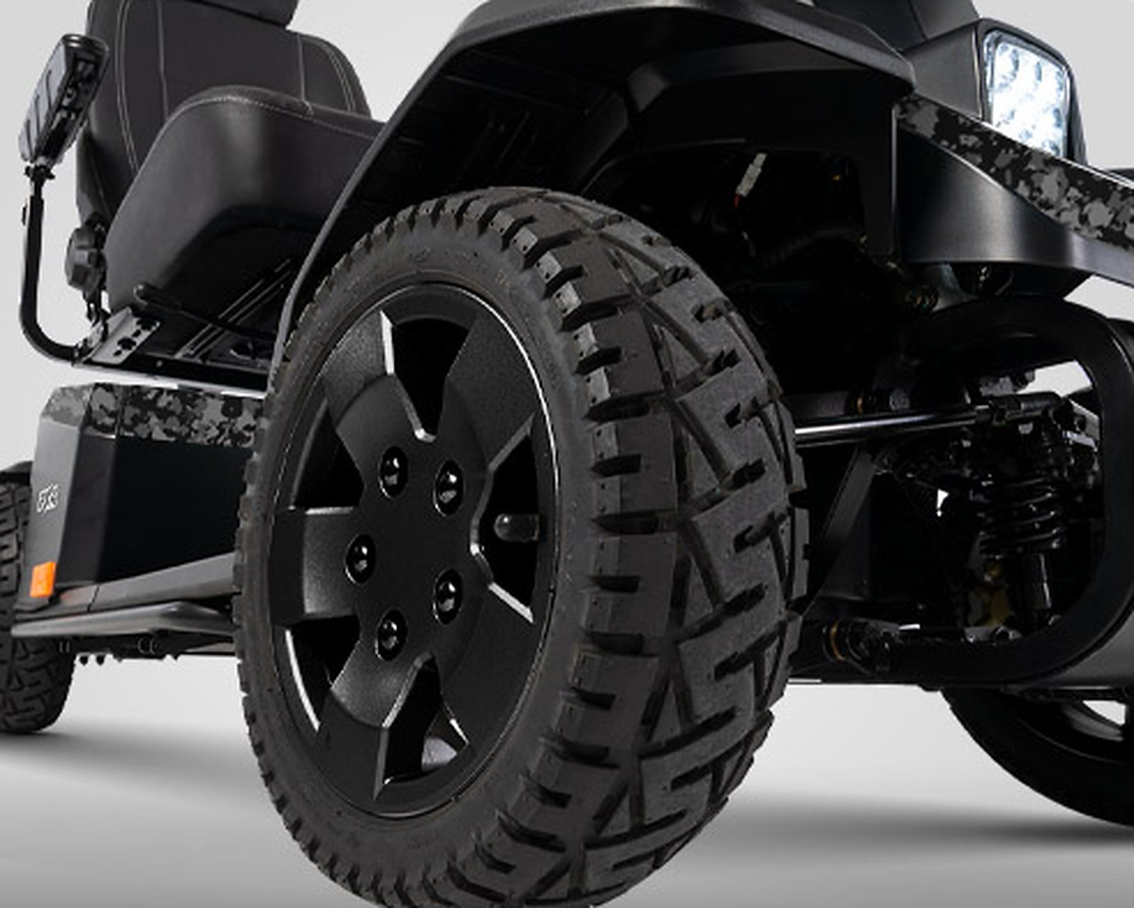 Pride Mobility PX4 SC134 13-inch pneumatic front tire and full suspension detail